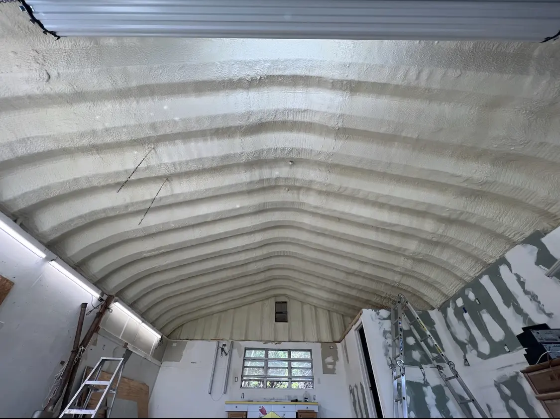Spray polyurethane foam applied to the underside of a metal roof deck in Hopkinton